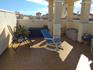 Roof terrace with table chairs and loungers